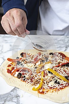 Man pointing at homemade pizza
