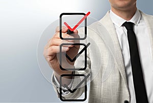 Man pointing at red check mark in box on virtual screen, closeup
