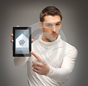 Man pointing at tablet pc with email icon