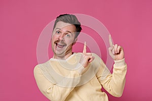 Man pointing up with his finger advicing to make a right choic photo