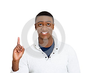 Man pointing up looking at something above showing with index finger