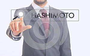 Man pointing at word Hashimoto