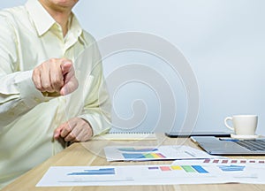 man pointing while working on document with copy space