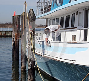 Man Polishing Boat