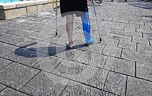 Man in the pool with waterproof leg plaster protection