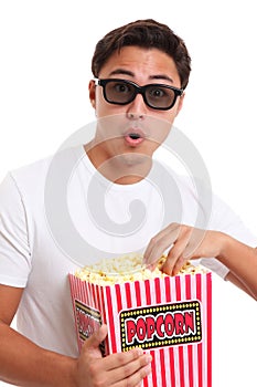 Man with popcorn bucket and 3D glasses