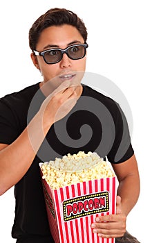 Man with popcorn bucket and 3D glasses