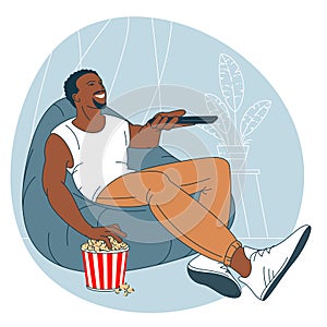 Man with popcorn is watching TV