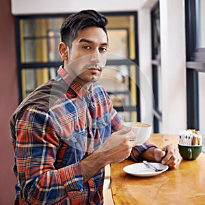 Man, portrait and cafe with coffee for morning, beverage or drink at indoor restaurant. Young and handsome male person