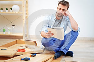 Man portrait and do it yourself furniture assembly