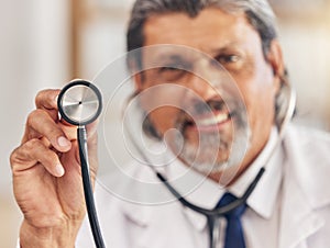 Man, portrait and a doctor with a stethoscope for healthcare, consultation or medical test. Happy, hospital and a mature