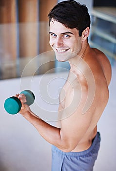 Man, portrait and dumbbell for weightlifting, fitness and muscle training for body and self care. Topless athlete