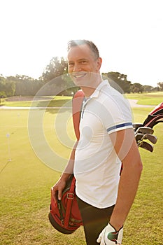 Man, portrait and golf course for professional sport and happy golfer for training or fitness on field. Athlete, smile