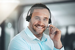 Man, portrait and headset at call centre for customer support or telemarketing sales, consultant or help desk. Male