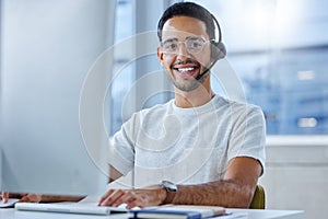 Man, portrait and headset at computer or call centre for technical support, telemarketing or crm. Male person, face and