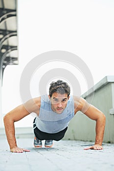 Man, portrait and push ups in fitness for exercise, workout or outdoor training on floor. Muscular male person or