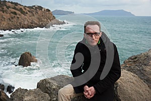 Man portrait on the seashore, Crimea winter.