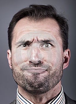 Man portrait with a strange expression