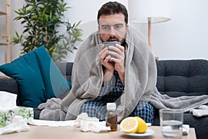 Man portrait suffering cold and flu at home