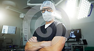 Man, portrait and surgery in operating room confident healthcare, professional or expert help. Male person, face mask or