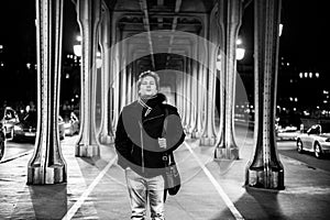 Man portrait under bridge in Paris