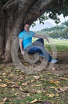 Man poses outside in the park