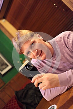 Man poses in pub