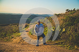 Man posing in the area of the Top of the world in Newport Beach, California, USA