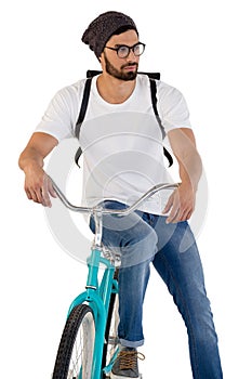 Man posing with bicycle against white background