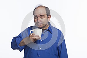 Man posing with coffee mug, horizontal