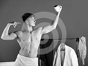 Man posing with cup