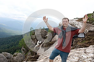 Man posing in front of glacier on Lago-Naki plateau