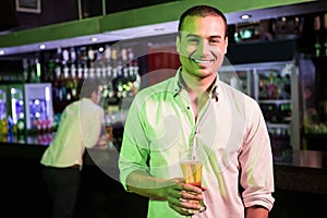 Man posing with glass of beer