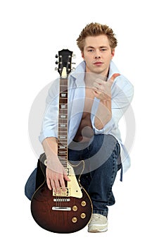 Man posing with his guitar