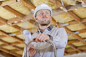 man posing near ladder repair design constructor
