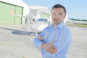 Man posing at tarmac