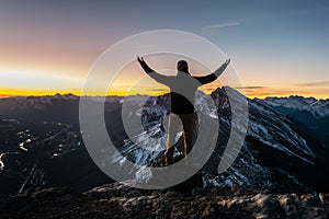 Man posing on top of the mountain