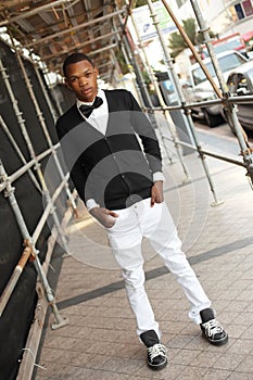 Man posing under scaffolding