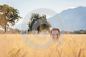 Man posing in a Wheat filed