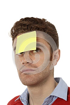 Man with post it on his forehead