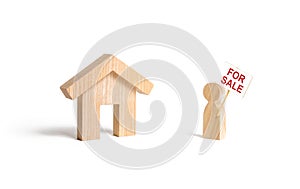 A man with a poster for sale stands near the house on an isolated background. concept of selling a home, buying from the owner.