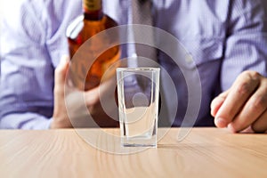 Man pouring alcohol into the glass