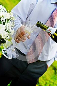 Man pouring champange to wineglass