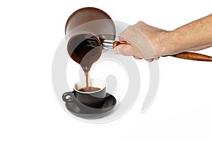 Man pouring coffee into cup isolated white background