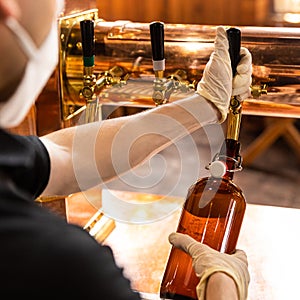 Man filling beer bottle
