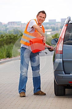 Man pouring fuel