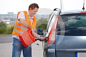 Man pouring fuel