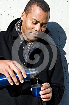 Man pouring tea