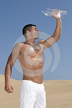 Man pouring water over face