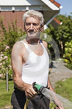 Man pours his garden photo